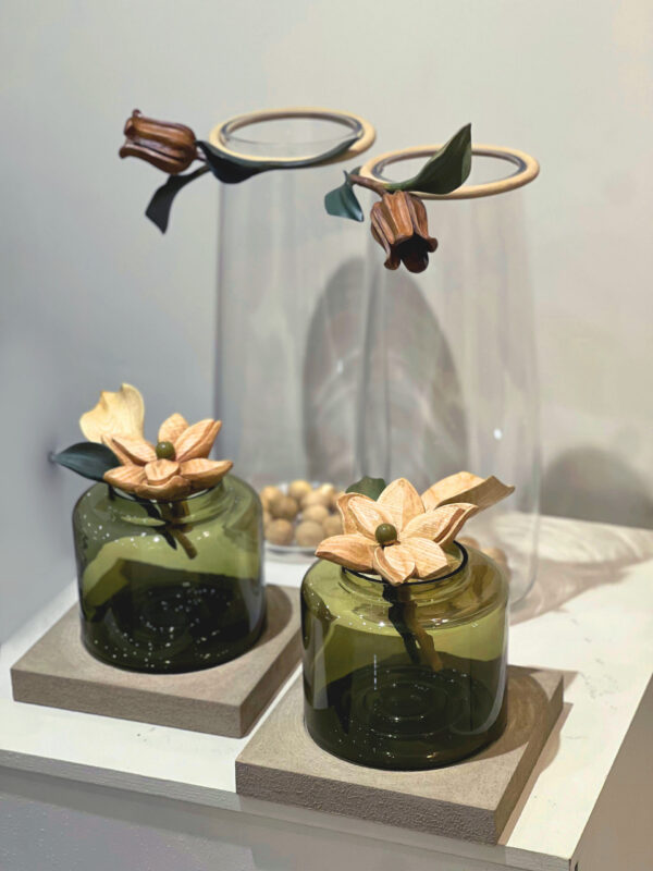 Green glass vases with Naked Wood flowers